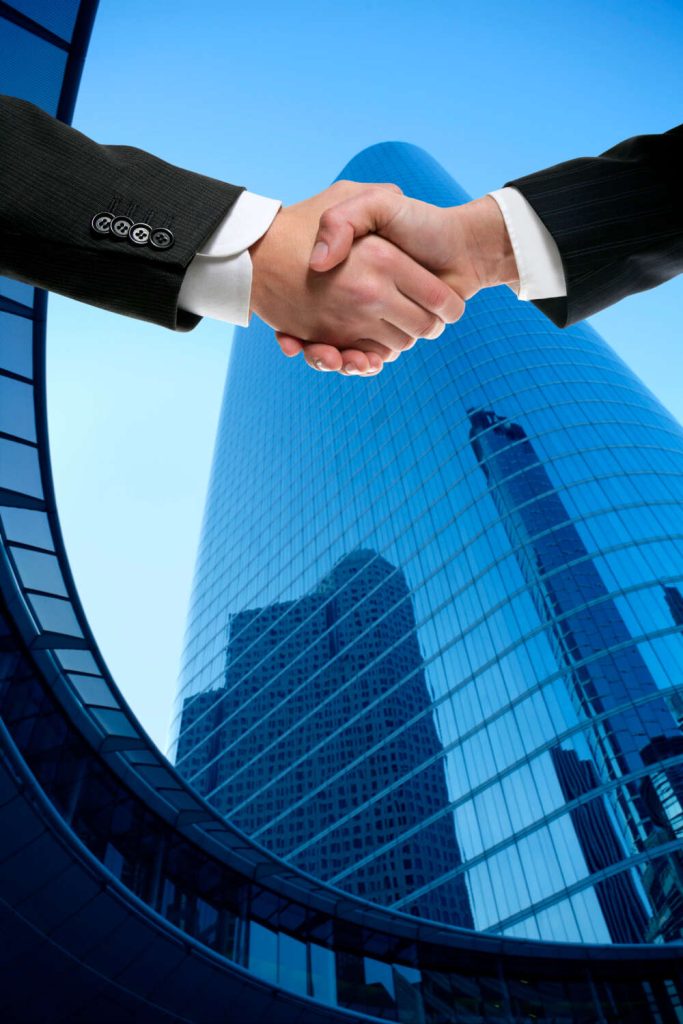 businessman partners shaking hands with suit 1